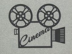 an old movie camera with the word cinema printed on it