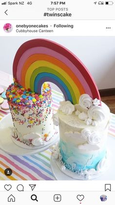 two cakes with rainbow frosting and sprinkles are on the table next to each other