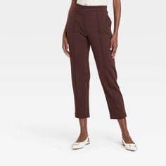 These High-Rise Tapered Ankle Knit Pull-On Pants from A New Day™ provide a polished look that blends comfort with elegance. These pull-on pants are made from a soft fabric blend with added spandex for comfortable wear that moves with you. Plus, they're tailored in a flattering high-rise, ankle-length silhouette and feature a tapered-leg cut for added flair. An elasticized waistband and slash pockets on the sides complete the design with functional flair. A New Day™: Style that goes wherever you Jumpsuits Women, Tapered Pants, Womens Fleece, Bottom Clothes, Pull On Pants, Polished Look, A New Day, Bottoms Pants, Ankle Length