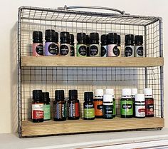 a metal rack with bottles on top of it next to a shelf filled with essential oils