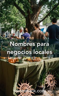 people standing around a table with plants on it and the words local logos above them