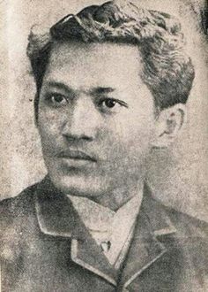 an old black and white photo of a man with curly hair, wearing a jacket