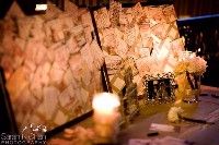 a table topped with lots of cards and candles