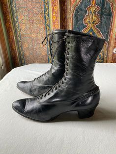 These classic suffrage era shoes are in marvelous shape for their age. With a profile of an ankle high bootie, the lace up, pointed toe styling is identified as a "must have" for authentic women's costuming for historic correctness. I find both shoes to be in comfortable, wearable condition. The soft leather has significant wear on the tongue, but still laces well and feels comfortable to use. It fits my size 7.5 generously, although I do have a naturally slim foot and would call them a "narrow" size. The real stacked leather heel and heavy leather sole also have significant wear, with one shoe probably needing repair within a season of use. If used for rare costume dates (my recommendation for antique leather)  these shoes should last through quite a few fantastic dressy events. Historical Formal Boots With Leather Sole, Victorian Boots With Leather Sole For Formal Wear, Victorian Boots With Leather Sole, Victorian Formal Boots With Leather Sole, Formal Victorian Boots With Leather Sole, Historical Round Toe Boots For Formal Occasions, Historical Formal Boots With Round Toe, Historical Round Toe Formal Boots, Victorian Almond Toe Fitted Boots