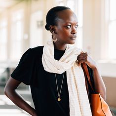 Your go-to transitional scarf is here! The Nicely Neutral Striped Scarf is handwoven of a bamboo silk, making it lightweight and breathable on those spring and fall days that warm up in the afternoon. With tan stripes across the weft on a white base, this is your new reliable neutral accessory. The long ends of the scarf are selvaged and the short ends are finished in a short white fringe. Neutral Accessories, Chain Scarf, Candle Wall Decor, White Fringe, Striped Scarf, Fall Days, Bamboo Silk, Scarf Hat, Accessories Bags Purses