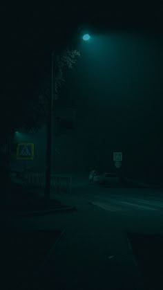 an empty street at night in the dark