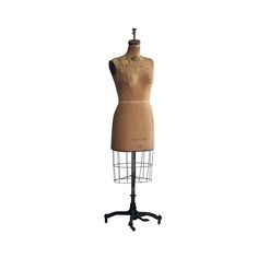 a mannequin on a stand with a white background