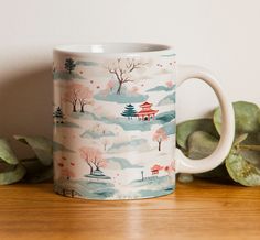 a coffee mug sitting on top of a wooden table