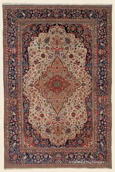 an antique persian rug with blue, red and white colors on it's border