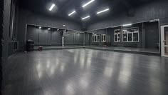 an empty dance studio with mirrors and lights