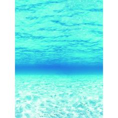 an underwater view of the ocean with clear blue water and white sand on the bottom