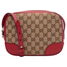 This Gucci crossbody bag is made of original brown and beige monogram printed canvas with red leather finishes. The bag features light-gold hardware, an adjustable shoulder strap, a GG charm and top zip closure with double zipper tabs. The zipper open to a beige canvas interior with card slots and patch pockets. Category, outlet. Color: Ebony & Rosso (beige & red) Material: canvas with Gucci’s monogram print and red grained leather finishes Model No. 449413 Measurements~ Height 6.75” Width 8.75” Depth 3.75” Strap drop: 20” Comes with a dust bag. Brand new condition. Excellent. Gucci Crossbody Bag, Gucci Crossbody, Gucci Monogram, S Monogram, Monogram Prints, Printed Canvas, Monogram Canvas, Fashion Handbags, Purses Crossbody