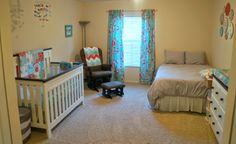 a baby's room with a crib, dresser and bed