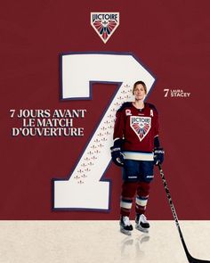 a woman standing in front of a number seven sign with hockey stickers on it