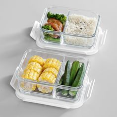 two plastic containers filled with rice, corn and broccoli next to each other