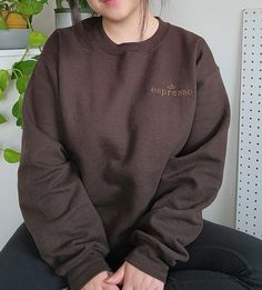 Embrace the cozy vibes and make a statement with our Espresso Embroidered Sweater Pullover Key Features: - Color: Dark Brown - Material: Soft, premium fabric, 8 oz. poly/cotton blend - Embroidered "Espresso" words in a contrasting thread  - Fit: Relaxed and comfortable - Care Instructions: Machine wash cold, tumble dry low *For an oversized look, get 1-2 sizes larger than your normal size. Otherwise, this sweater fits true to size (refer to the size guide photo) Brown Crewneck Outfit, Crewneck Outfit, Oversized Aesthetic, Brown Crewneck, Aesthetic Sweatshirt, Brown Sweatshirt, Sweater Fits, Sweatshirt Outfit, Cozy Vibes