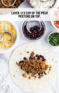 the ingredients to make black beans on tortilla laid out in bowls