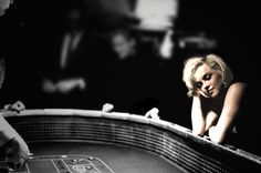 black and white photograph of a woman leaning over a roule