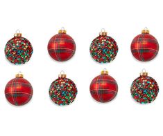 six red christmas ornaments with gold trim on each ornament, all decorated in different designs