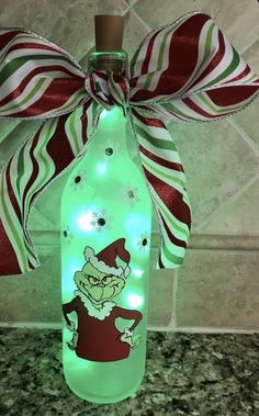 a lighted bottle with an elf on it