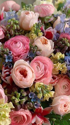 a bouquet of pink and blue flowers on a table