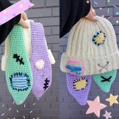 two crocheted hats hanging from hooks with stars and confetti on them