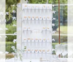 a table set up with desserts and wine glasses