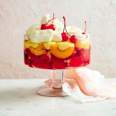 a trifle with fruit and whipped cream on top