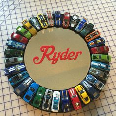 a toy car display with the word ryder written in red on it's center