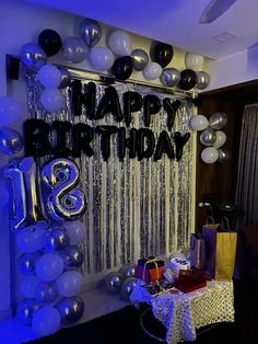 a birthday party with balloons and presents