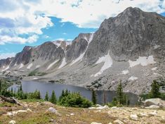 a mountain lake surrounded by trees and rocks