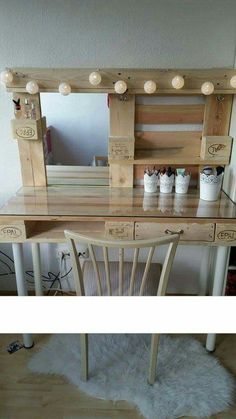 the vanity is made out of wood and has lights on it