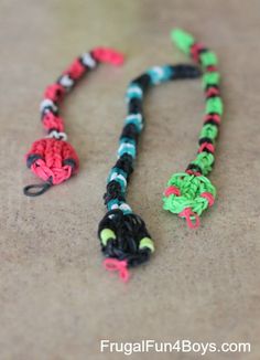 the colorful necklace is made with black, green, red and blue yarns on it