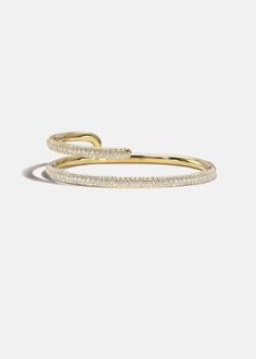 —The Crescendo Collection Crafted of solid 18K gold, the Mono Pavé Bracelet features bold lines that cascade around the wrist in new and unexpected directions. Approx 0.80tcw / 38.2 grams Diamond Grade: F/G color, VS clarity 2.25 " in length Available in Yellow Gold -Handmade in Los Angeles, California. Gold Bracelets Stacked, Pave Bracelet, Expensive Jewelry Luxury, Jewelry Workshop, Dope Jewelry, Girly Jewelry