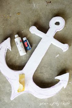 an anchor painted with white paint and some glue