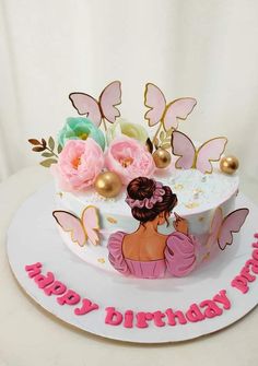 a birthday cake decorated with pink flowers and butterflies