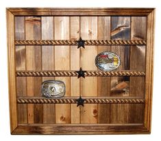 a wooden shelf with four different items on it's sides and rope around the bottom