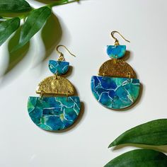 Half circle gold and blue earrings  Handmade with love 💕 Materials used: polymer clay, metal leaf, resin and stainless steel french hooks One of a kind, there's only pair available. It was made using a watercolor effect 💙 Dimensions Length: 2.5in Width: 1.55in Artsy Blue Polymer Clay Earrings, Artsy Blue Resin Earrings, Blue Artsy Resin Earrings, Polymer Clay Leaves, Clay Leaves, Gold And Blue, Metal Leaves, Half Circle, Bead Stringing