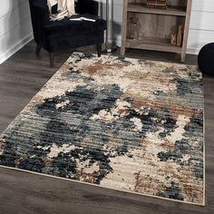 an area rug in a living room with a chair and bookcase