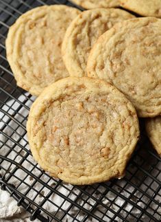 several cookies sitting on top of a cooling rack