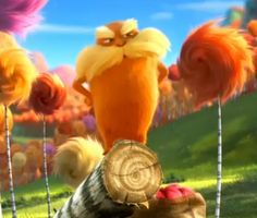 the lorax is standing on top of a log