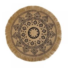 a round rug with an intricate design on the bottom and fringes around the edges