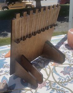 a wooden book stand on top of a table