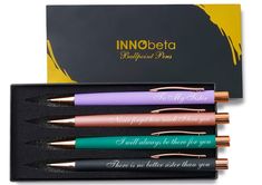 four pens in a box with writing on them