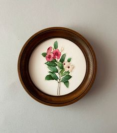 a painting of pink and white flowers in a wooden frame