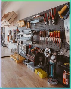 there are many tools hanging on the wall