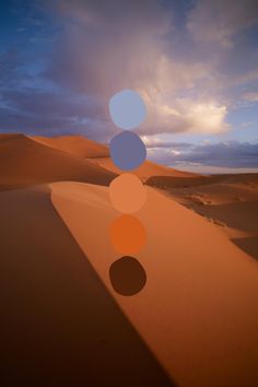 an image of three circles in the desert