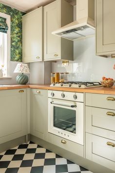 the kitchen is clean and ready for us to use it's oven, stove top, cabinets, and counter tops