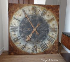 an old rusty clock with roman numerals on it