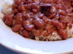 a white plate topped with rice and beans